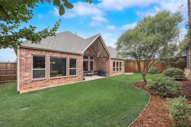 106 Magnolia Ln, Hickory Creek, TX 75065 - back of property with brick siding, roof with shingles, and a patio
