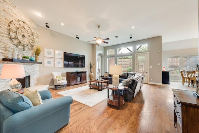 106 Magnolia Ln, Hickory Creek, TX 75065 - living area featuring a fireplace, wood finished floors, ceiling fan, recessed lighting, and baseboards