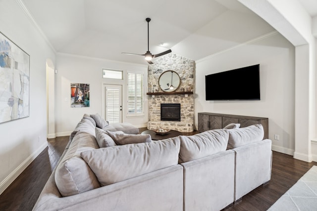 5400 Fringetree Dr, Mckinney, TX 75071 - living area featuring dark wood-type flooring, ceiling fan, ornamental molding, vaulted ceiling, and a stone fireplace