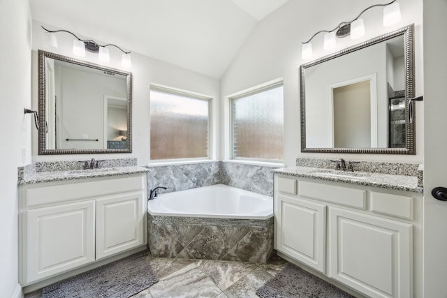 5400 Fringetree Dr, Mckinney, TX 75071 - bathroom featuring vaulted ceiling, two vanities, and a bath