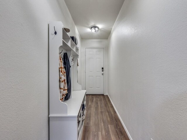 14340 Cloudview Way, Fort Worth, TX 76052 - mudroom featuring baseboards, dark wood-style floors, and a textured wall