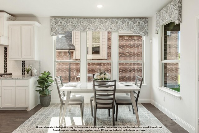dining area featuring dark wood-style floors, baseboards, and recessed lighting