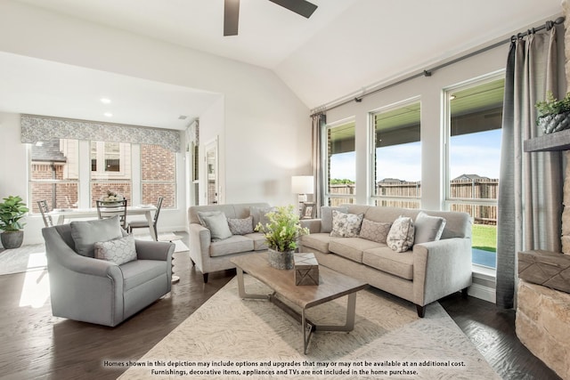 living area with healthy amount of natural light, wood finished floors, a ceiling fan, and lofted ceiling