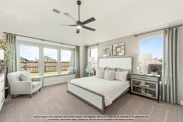 carpeted bedroom with baseboards, a ceiling fan, and lofted ceiling