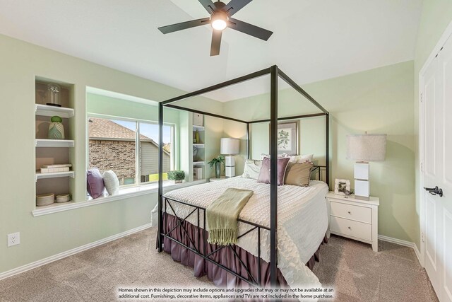 carpeted bedroom featuring baseboards and ceiling fan