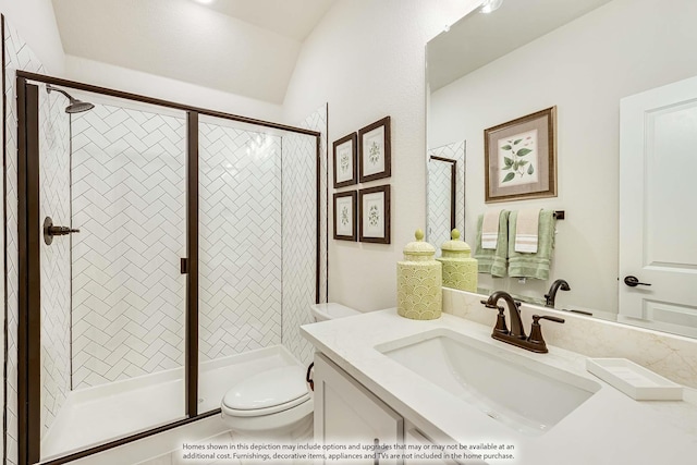 bathroom with toilet, a stall shower, and vanity
