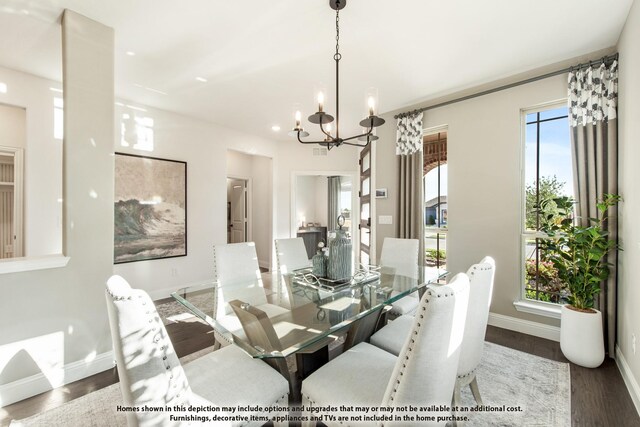 dining area featuring a chandelier, baseboards, wood finished floors, and recessed lighting