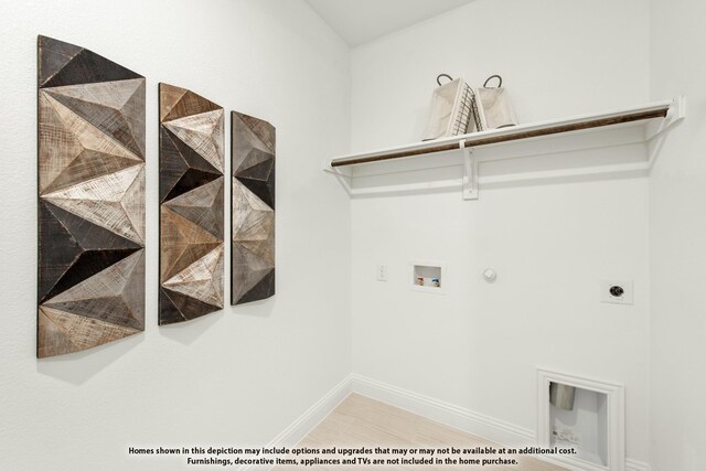 laundry area with hookup for an electric dryer, gas dryer hookup, hookup for a washing machine, and baseboards