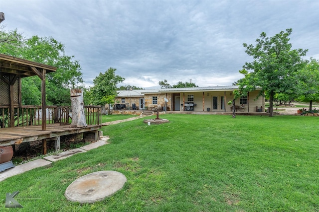 350 County Road 606 Unit B, Tuscola, TX 79562 - view of grassy yard featuring a wooden deck