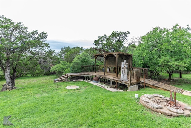 350 County Road 606 Unit B, Tuscola, TX 79562 - view of green lawn featuring a wooden deck and view of scattered trees