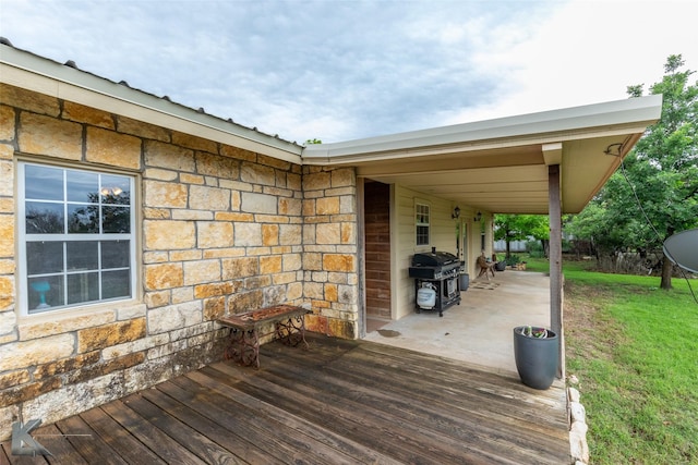 350 County Road 606 Unit B, Tuscola, TX 79562 - wooden terrace featuring area for grilling and a lawn