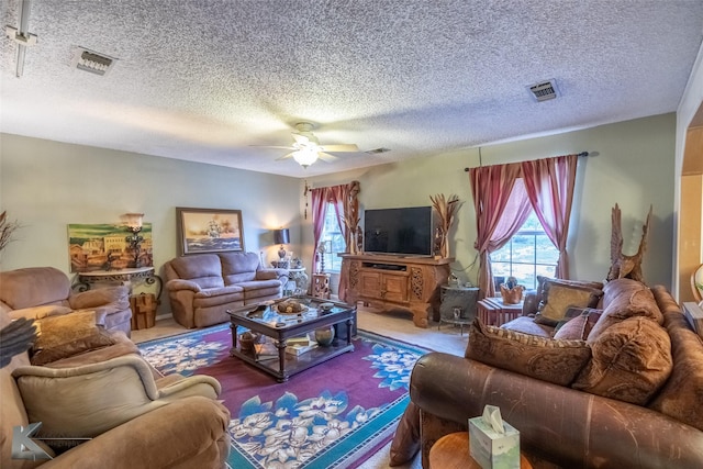 350 County Road 606 Unit B, Tuscola, TX 79562 - living room with ceiling fan, a textured ceiling, and carpet floors