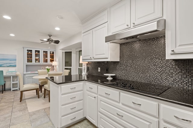 kitchen featuring under cabinet range hood, backsplash, recessed lighting, white cabinets, and ceiling fan