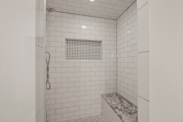 bathroom featuring tiled shower