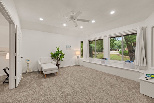 sitting room featuring ceiling fan, light colored carpet, recessed lighting, and baseboards