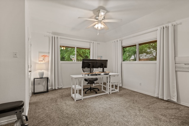 carpeted home office featuring plenty of natural light and a ceiling fan