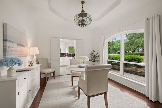 dining space featuring plenty of natural light and wood finished floors