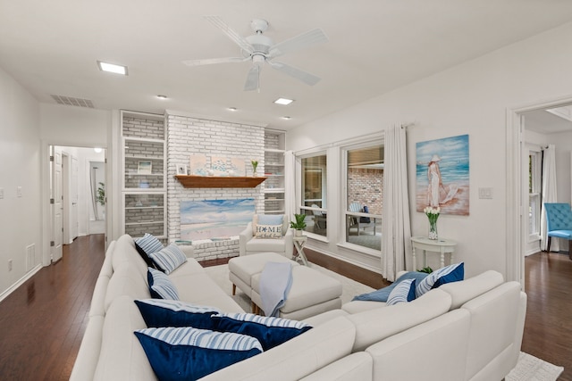 living room featuring wood finished floors, a ceiling fan, and baseboards