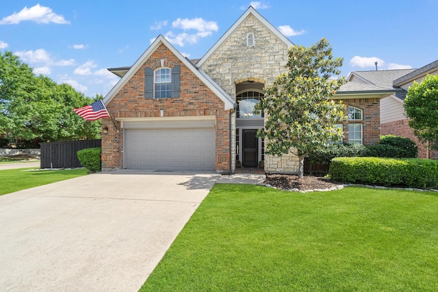 2499 Streamside Ct, Frisco, TX 75036 - view of front of property featuring concrete driveway, a garage, stone siding, and brick siding