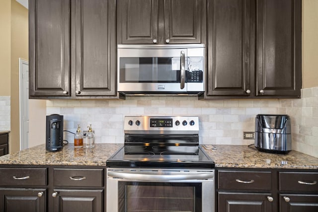 2499 Streamside Ct, Frisco, TX 75036 - kitchen featuring stainless steel appliances, dark brown cabinetry, backsplash, and light stone counters