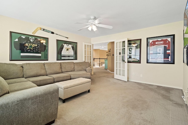 2499 Streamside Ct, Frisco, TX 75036 - carpeted living area featuring french doors, ceiling fan, and baseboards