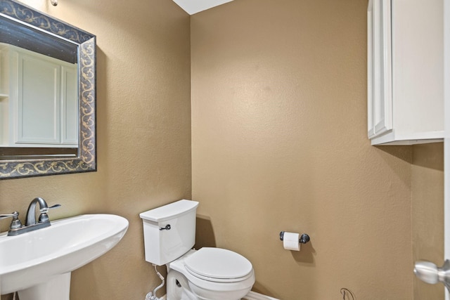 2499 Streamside Ct, Frisco, TX 75036 - bathroom featuring a sink and toilet