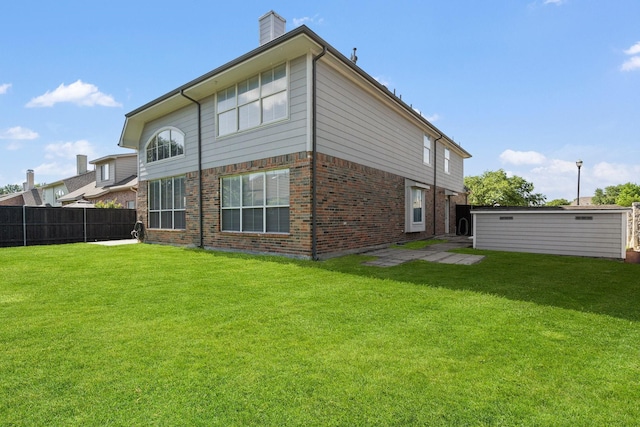 2499 Streamside Ct, Frisco, TX 75036 - rear view of property featuring brick siding and a chimney