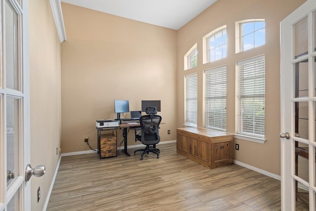 2499 Streamside Ct, Frisco, TX 75036 - office with light wood-style flooring, french doors, baseboards, and a high ceiling