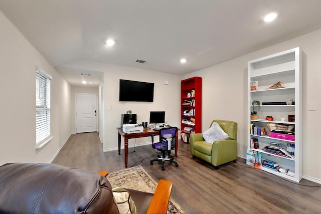office space with wood finished floors, recessed lighting, vaulted ceiling, and baseboards