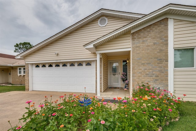 2313 Chandelle Dr, Irving, TX 75060 - view of front facade featuring brick siding, driveway, and a garage