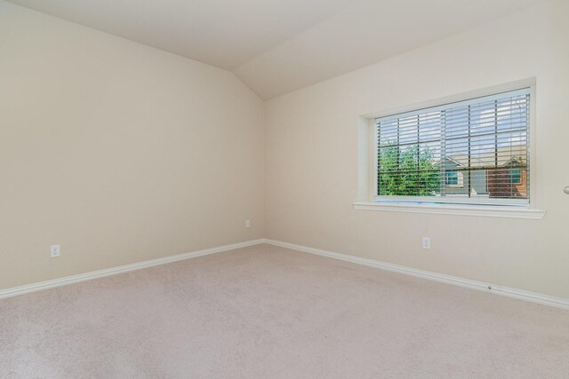 3644 Vienna St, Irving, TX 75038 - unfurnished room with carpet floors, baseboards, and lofted ceiling