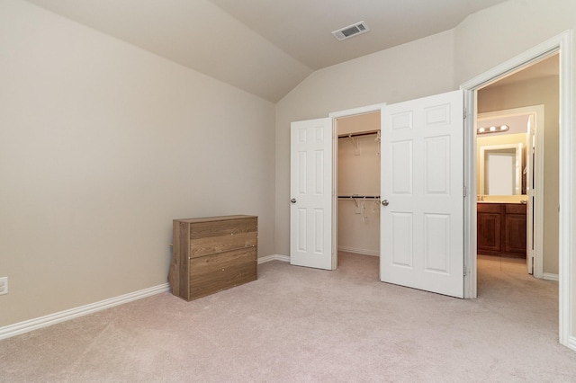 3644 Vienna St, Irving, TX 75038 - unfurnished bedroom with light carpet, a walk in closet, vaulted ceiling, baseboards, and a closet