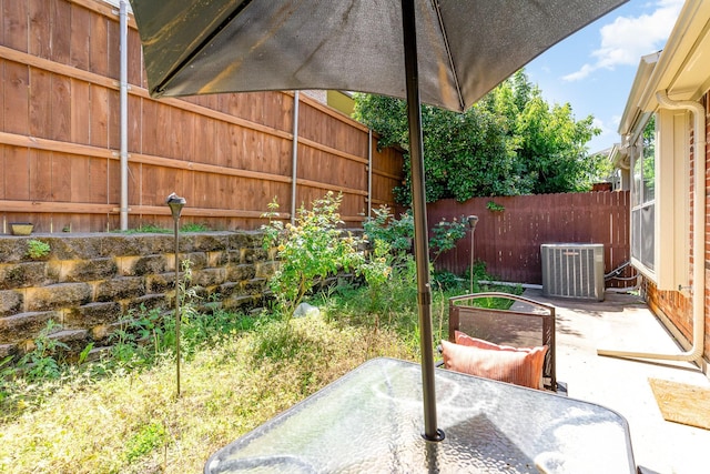 3644 Vienna St, Irving, TX 75038 - view of patio / terrace with central AC unit, fence, and outdoor dining area