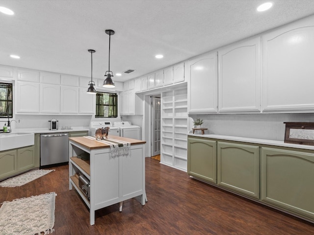 138 Selma Rd, Bowie, TX 76230 - kitchen with green cabinets, independent washer and dryer, stainless steel dishwasher, a sink, and recessed lighting