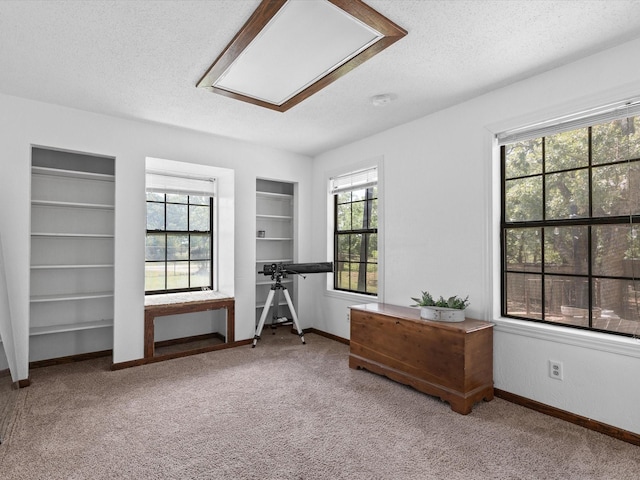138 Selma Rd, Bowie, TX 76230 - carpeted bedroom with a textured ceiling and baseboards