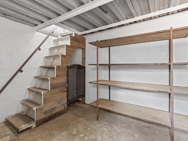 138 Selma Rd, Bowie, TX 76230 - basement featuring stairs and concrete block wall