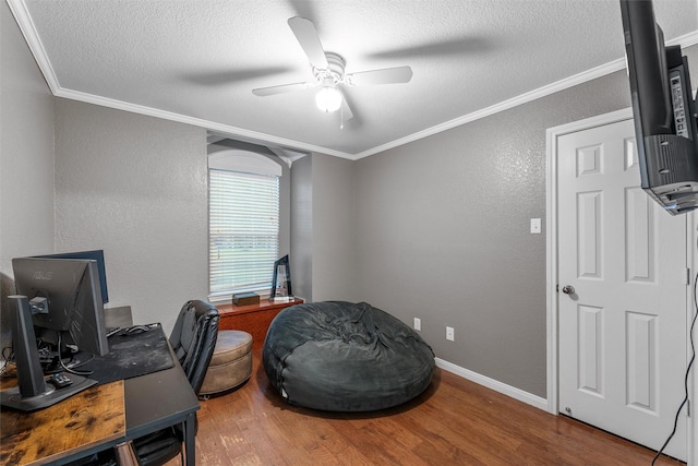 10612 Calaveras Dr, Waco, TX 76708 - office with a textured wall, ceiling fan, ornamental molding, wood finished floors, and a textured ceiling