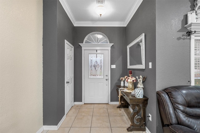 10612 Calaveras Dr, Waco, TX 76708 - foyer featuring a textured wall, light tile patterned floors, ornamental molding, and baseboards