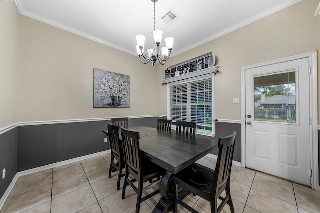 10612 Calaveras Dr, Waco, TX 76708 - dining area featuring light tile patterned floors, a chandelier, crown molding, and baseboards