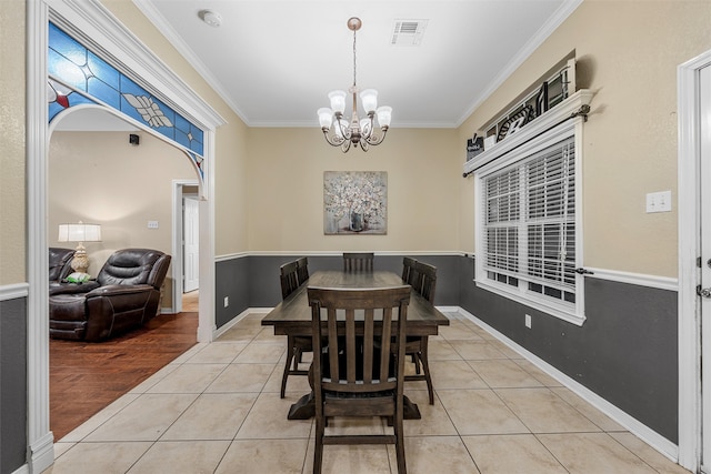 10612 Calaveras Dr, Waco, TX 76708 - dining area with ornamental molding, a chandelier, and light tile patterned floors