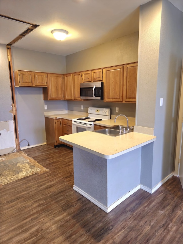 2164 Tanglewood Blvd Unit B202, Pottsboro, TX 75076 - kitchen with electric range, stainless steel microwave, a sink, light countertops, and a peninsula