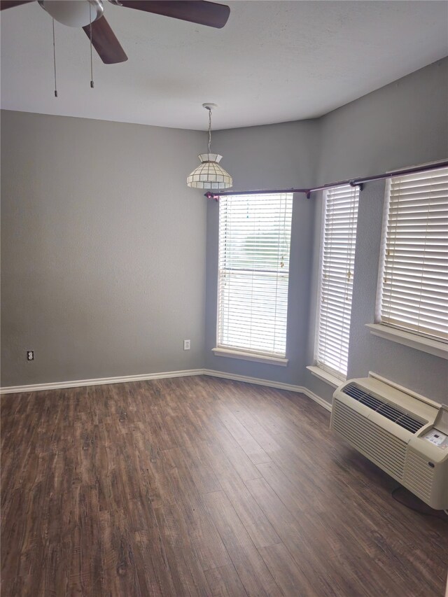 2164 Tanglewood Blvd Unit B202, Pottsboro, TX 75076 - spare room featuring ceiling fan, wood finished floors, baseboards, and a wall unit AC