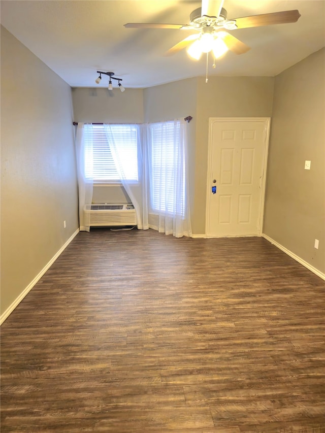 2164 Tanglewood Blvd Unit B202, Pottsboro, TX 75076 - empty room featuring ceiling fan, dark wood-style flooring, baseboards, and cooling unit