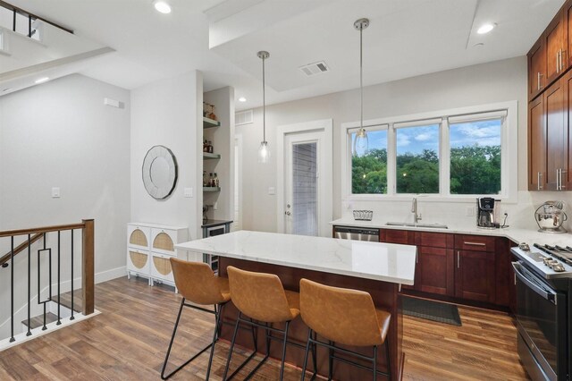 461 Rayner Ave, Fort Worth, TX 76111 - kitchen featuring gas range, a sink, dark wood-style flooring, dishwasher, and recessed lighting