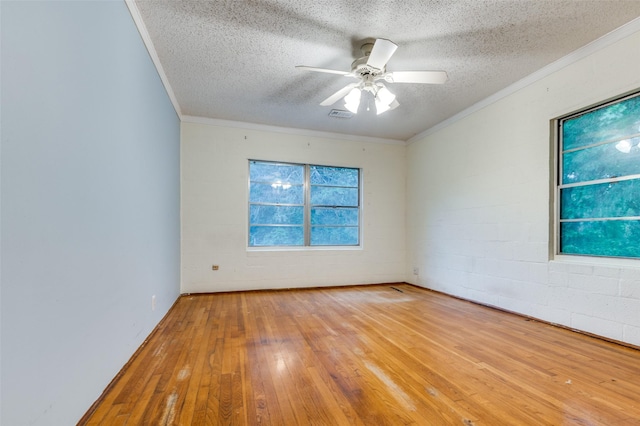 1455 N Joe Wilson Rd, Cedar Hill, TX 75104 - unfurnished room featuring a textured ceiling, crown molding, hardwood / wood-style flooring, and a ceiling fan