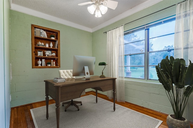 1455 N Joe Wilson Rd, Cedar Hill, TX 75104 - home office with wood finished floors, a ceiling fan, crown molding, and a textured ceiling