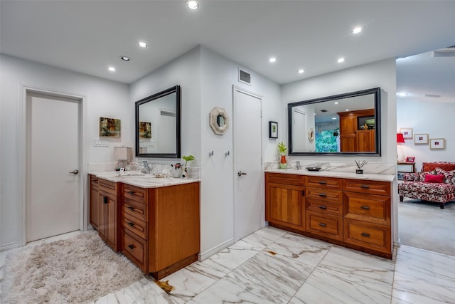 full bath with connected bathroom, recessed lighting, vanity, and marble finish flooring