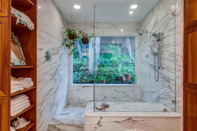bathroom featuring a marble finish shower, marble finish floors, and recessed lighting