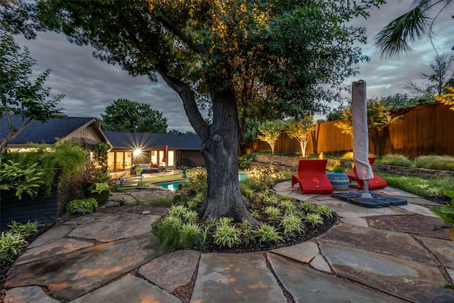 fenced backyard featuring a patio