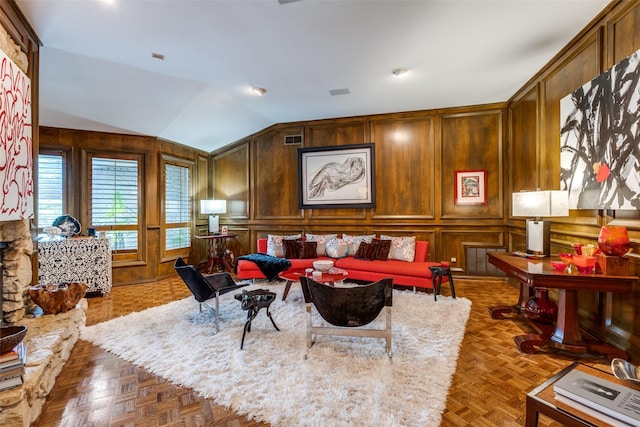 living room featuring lofted ceiling